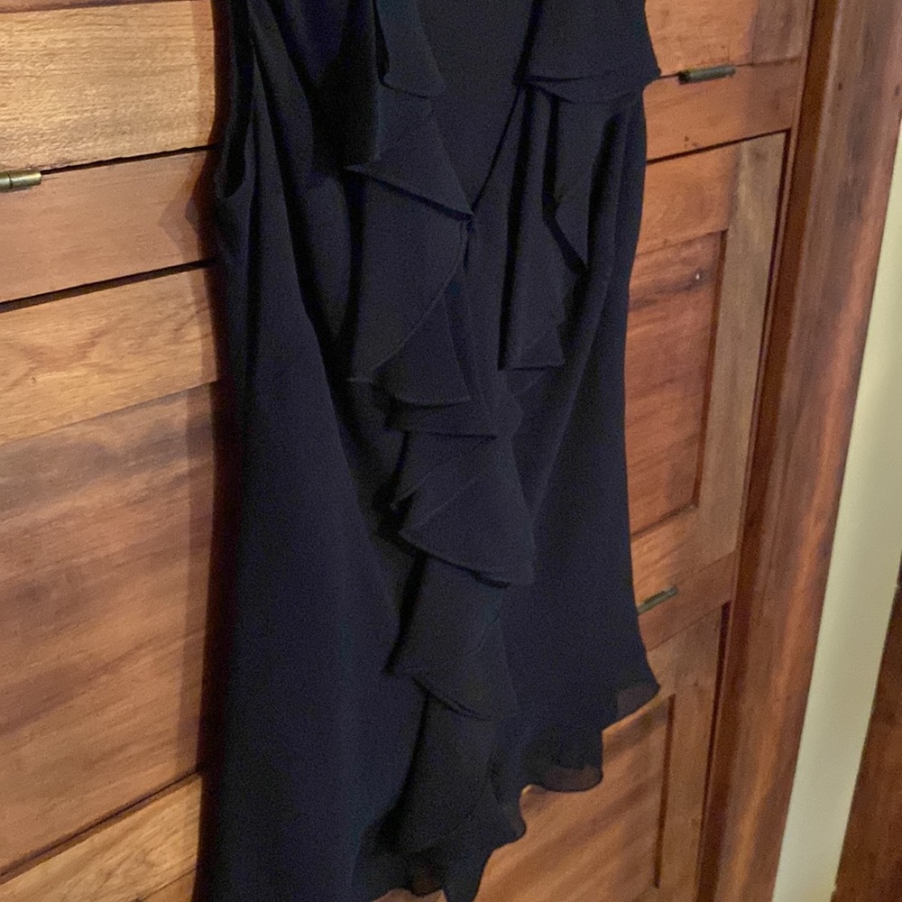 Woman’s black silk sleeveless ruffled  blouse